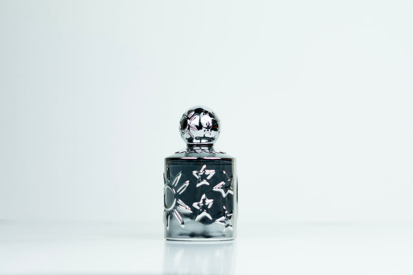 Sun Moon Stars Mania Pour Homme EDP fragrance bottle